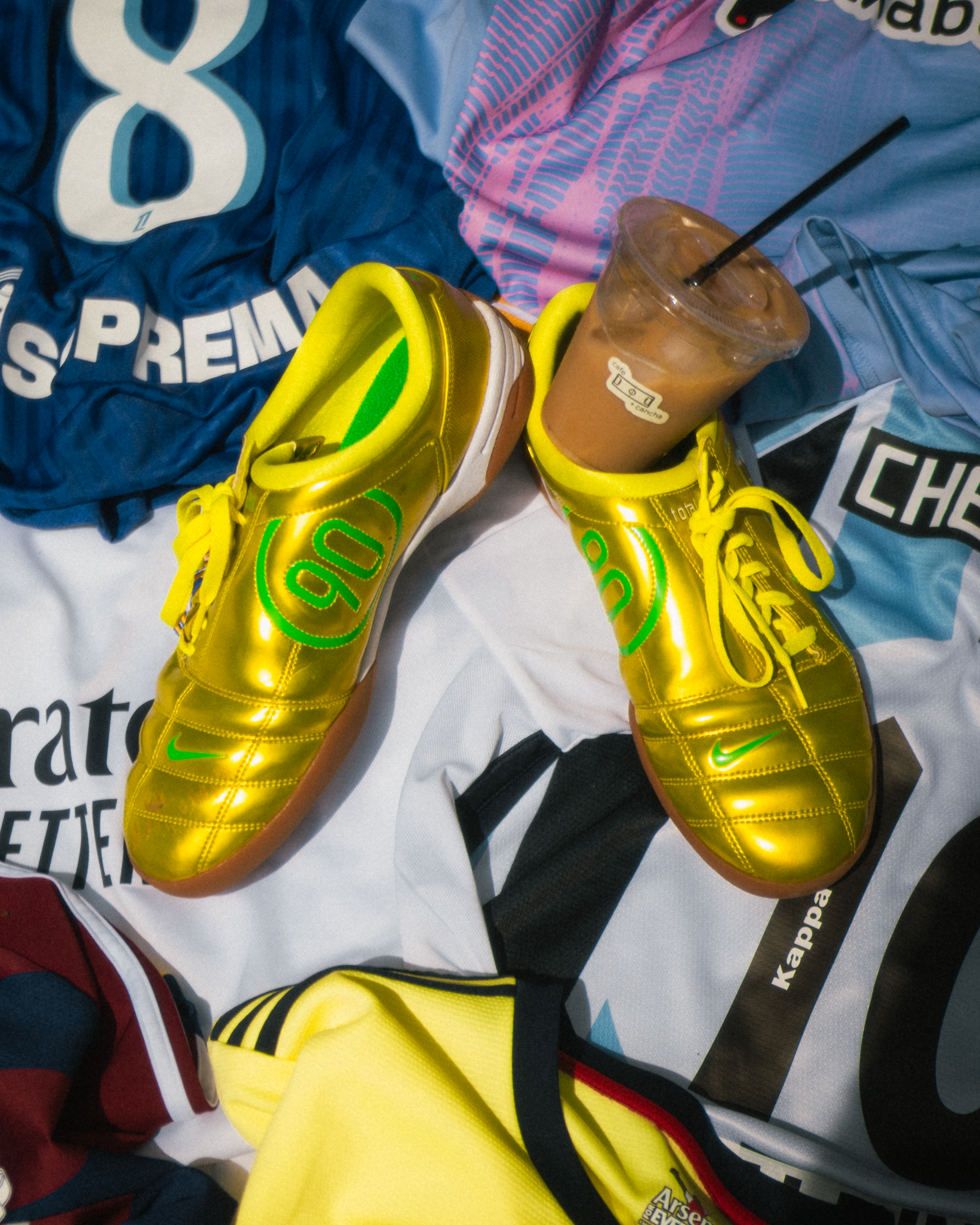 Gold futbol boots and coffee